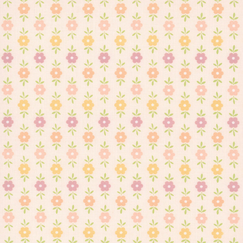 This blush pink fabric features purple, pastel pink, golden yellow, and light coral floral motifs. 