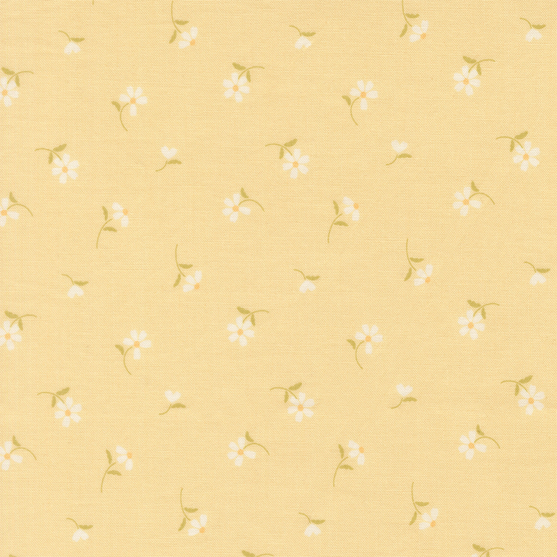 This cornsilk yellow fabric features tossed white daisies. 