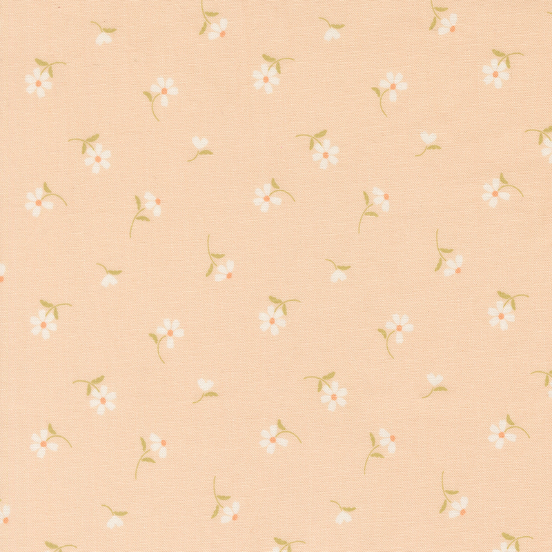 This pastel peach fabric features tossed white daisies. 