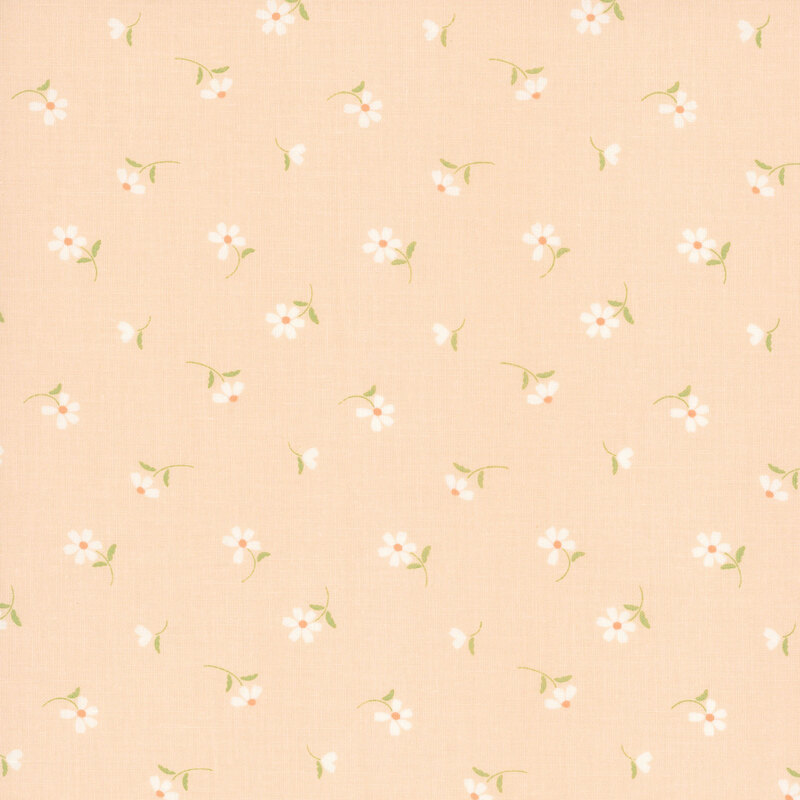 This pastel peach fabric features tossed white daisies. 