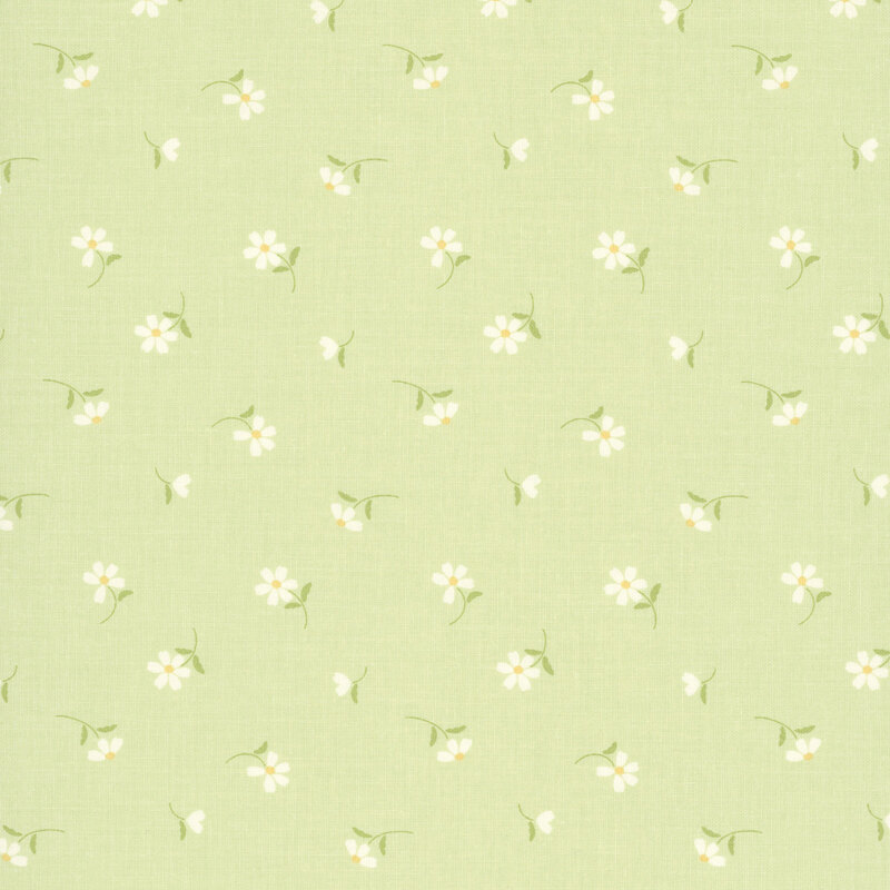 This spring green fabric features tossed white daisies. 