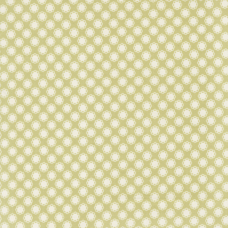 This spring green fabric features white doily motifs. 