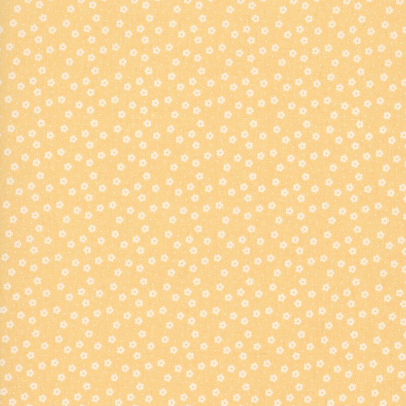 This golden yellow ditsy fabric features white florals. 