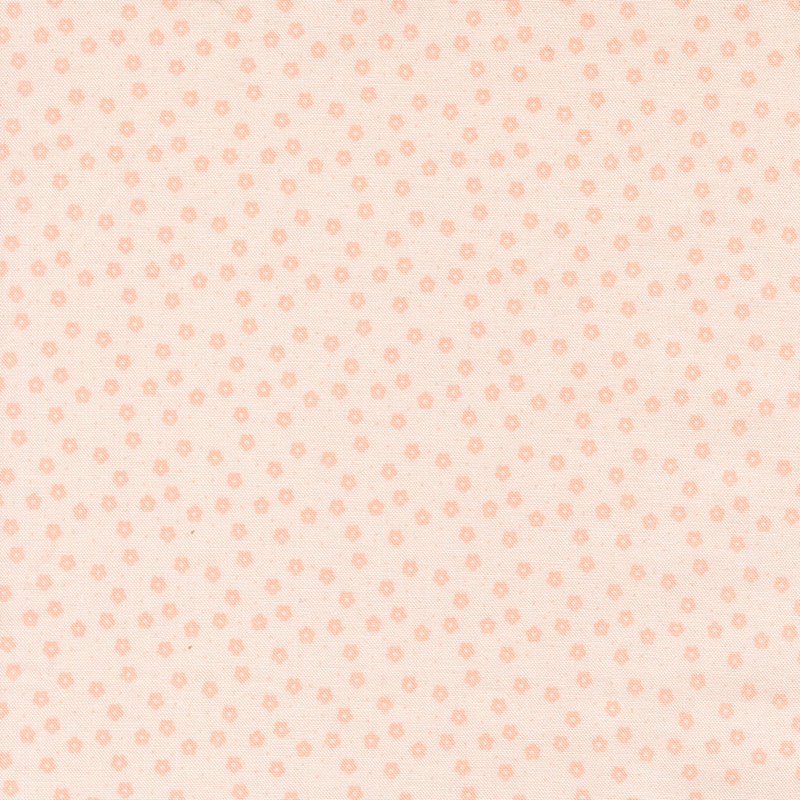 This soft pink ditsy fabric features tonal florals. 