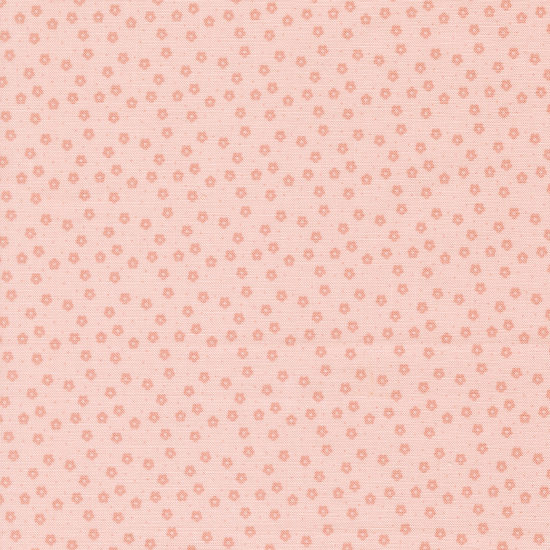This soft pink ditsy fabric features pink florals. 