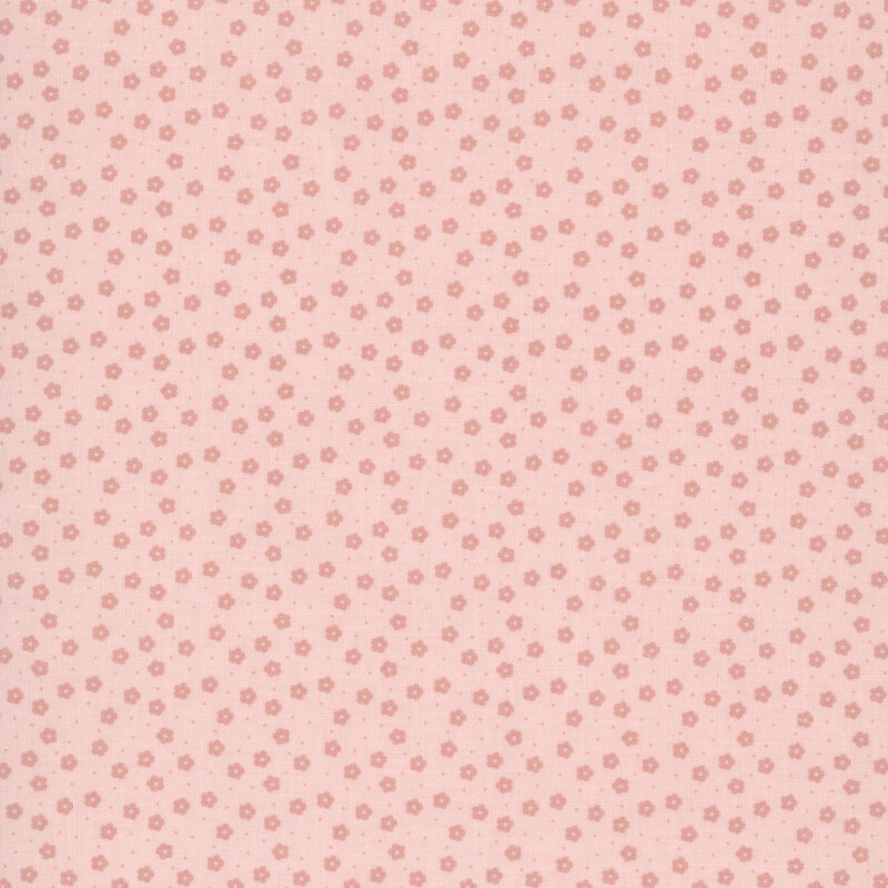 This soft pink ditsy fabric features pink florals. 