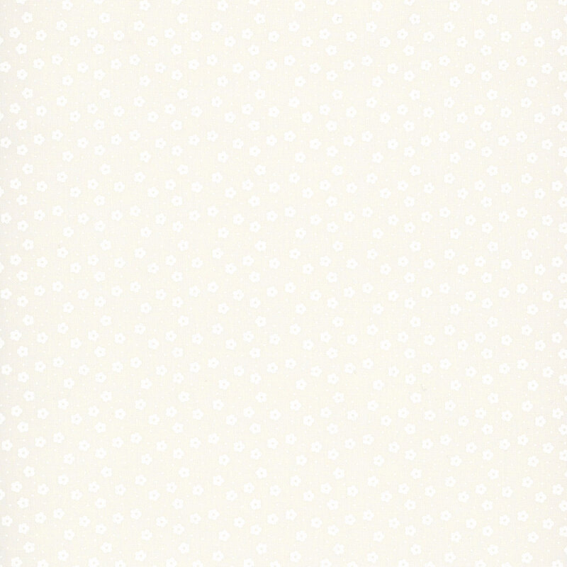 This white on white ditsy fabric features tiny florals. 