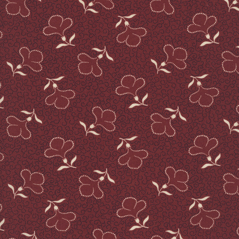 Red fabric with a packed design of dotted black swirls and cream-colored, tossed dotted florals.