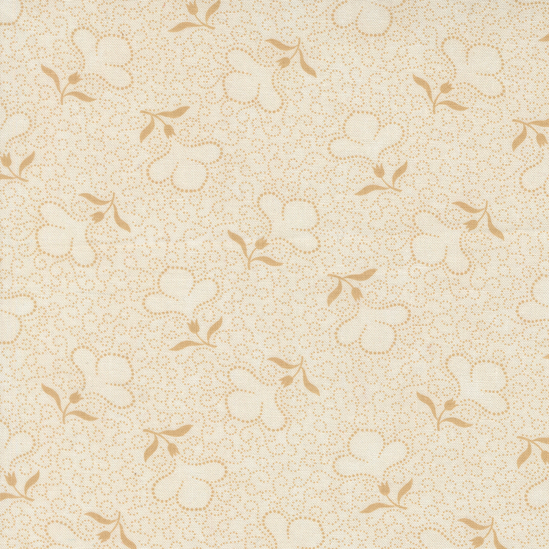 Cream fabric with a packed design of tan dotted swirls and tossed dotted florals.