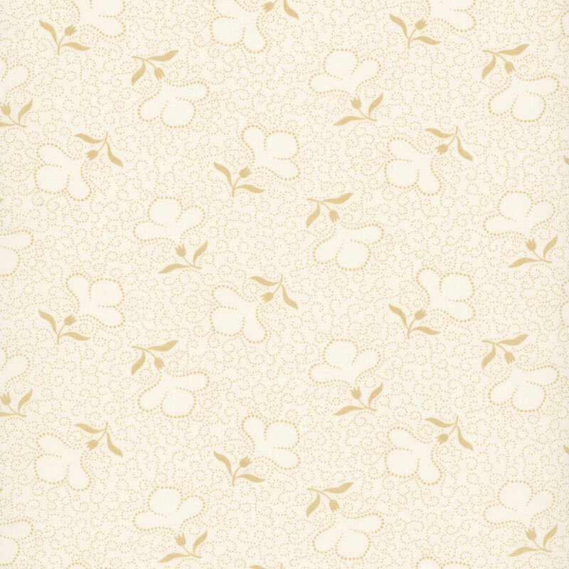 Cream fabric with a packed design of tan dotted swirls and tossed dotted florals.