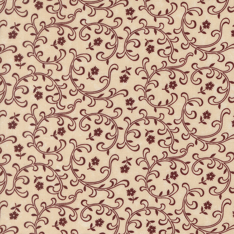 Tan fabric with tossed red florals and stylized leaves and vines.