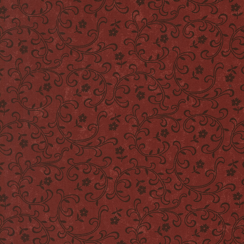 Red fabric with tossed black florals and stylized leaves and vines.