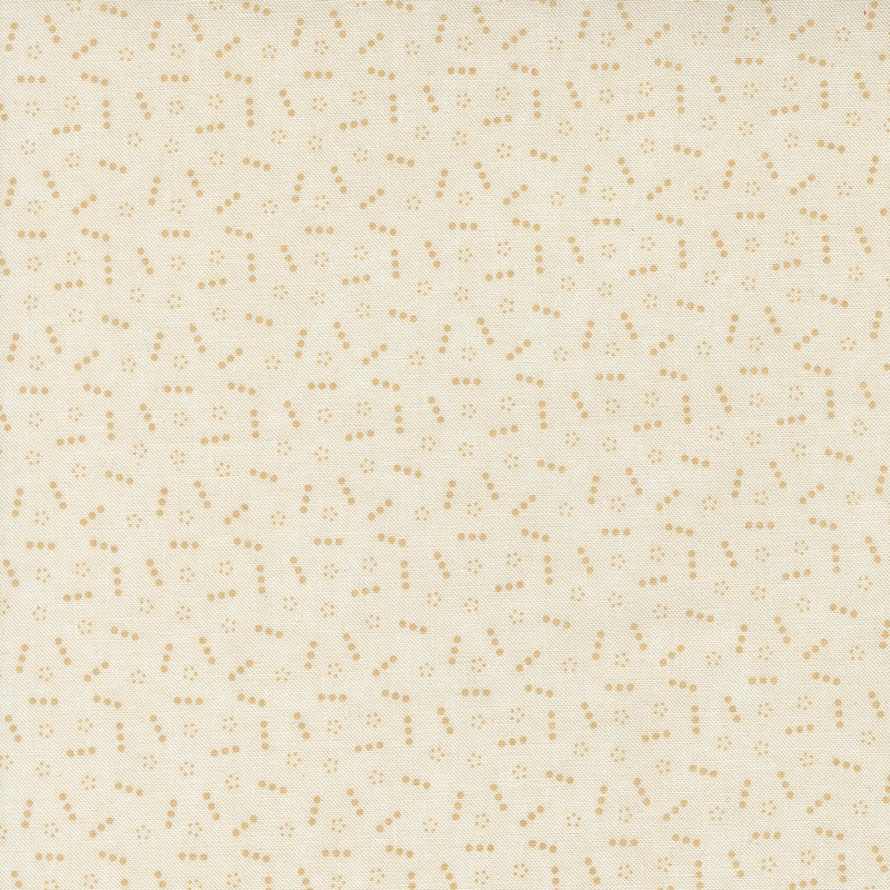 Cream-tan fabric topped with a scattered pattern of lines and groups of small tonal dots.