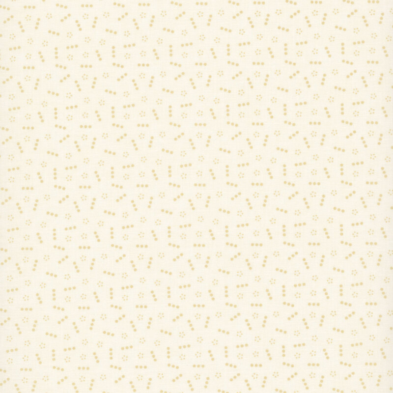 Cream-tan fabric topped with a scattered pattern of lines and groups of small tonal dots.