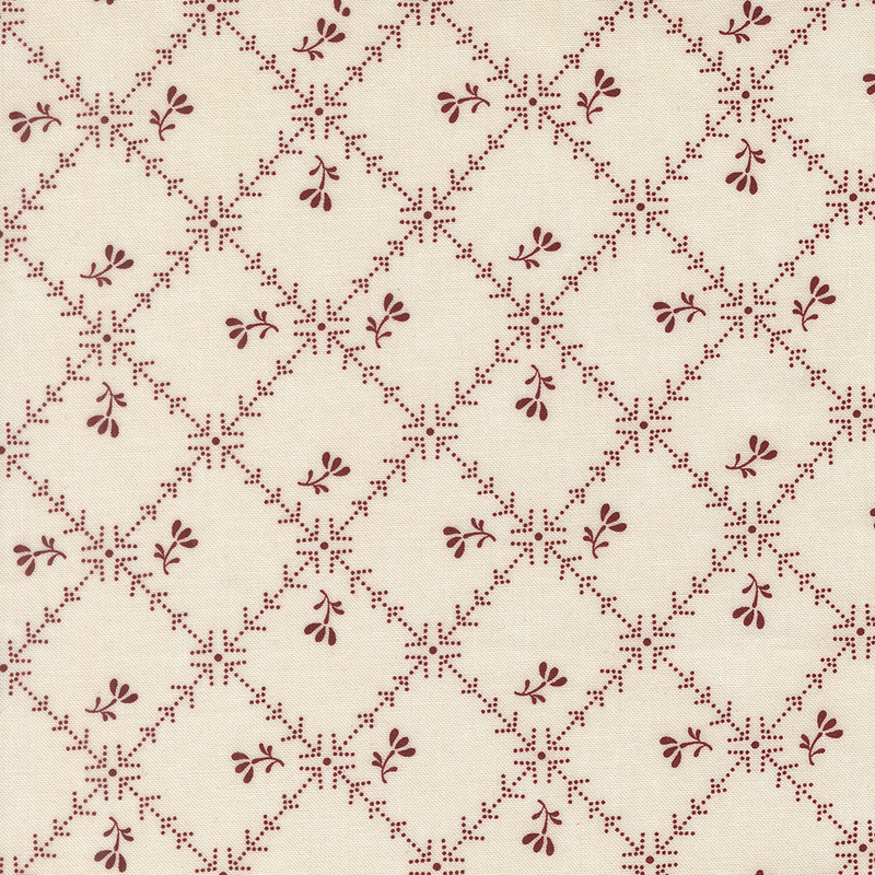 Tan fabric with a biased grid of red lines and arrows littered with red florals.