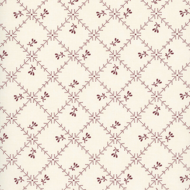 Tan fabric with a biased grid of red lines and arrows littered with red florals.