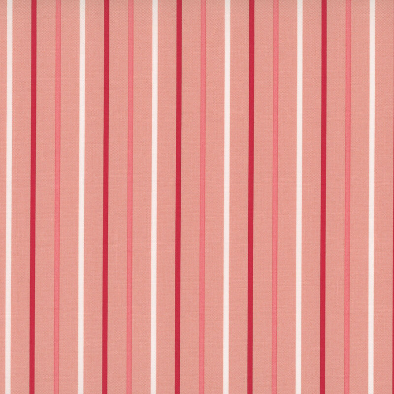 Salmon pink fabric with small white, dark red, and pink stripes.