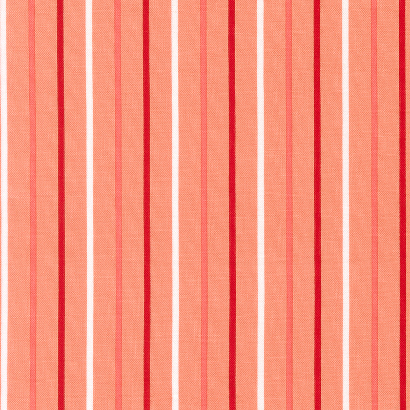 Salmon pink fabric with small white, dark red, and pink stripes.