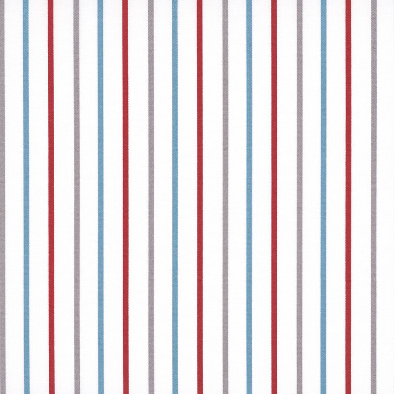 White fabric with small red, palomino, and blue stripes.