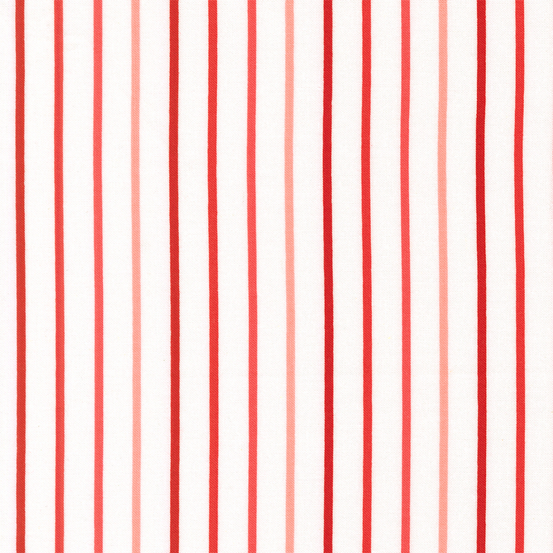 white fabric with small red, salmon pink, and pink stripes.