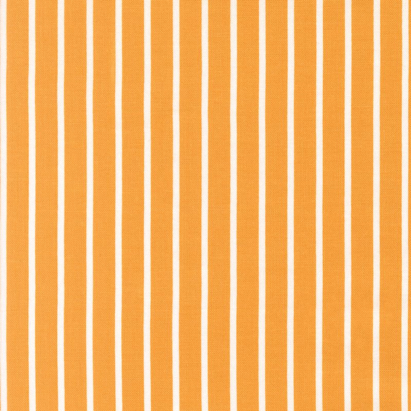 Honey fabric with small white stripes.