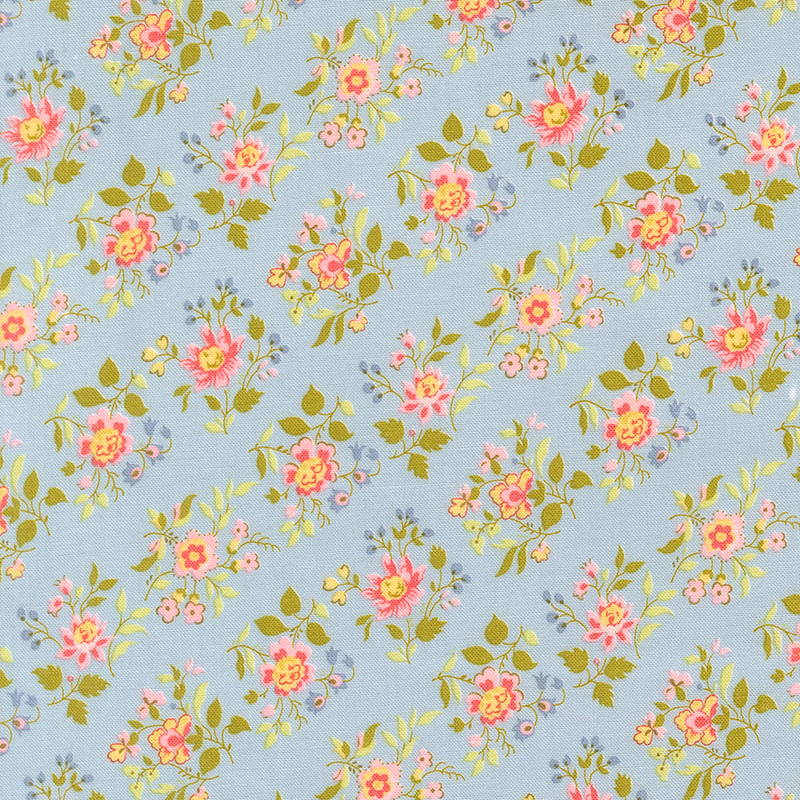 A soft blue fabric with pink and blue floral clusters. 