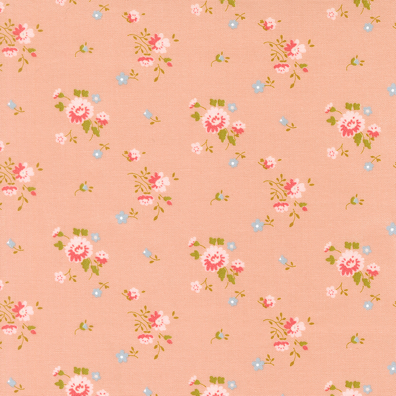 A peach fabric with pink and blue floral sprigs. 