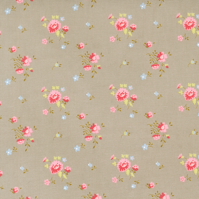 A latte fabric with pink and blue floral sprigs.