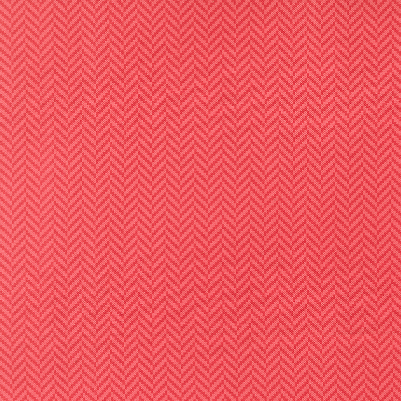 A rouge red fabric featuring a small herringbone pattern.