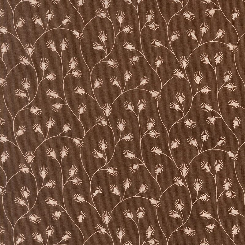 Brown fabric with a delicate pattern of cream vines adorned with stylized leaves