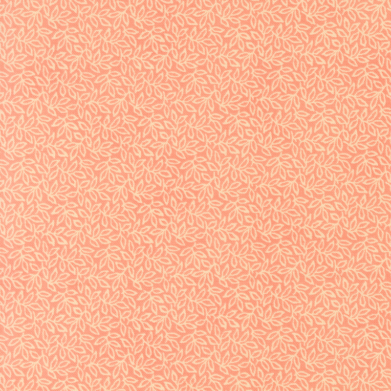 Salmon fabric with an intricate pattern of densely arranged leaves and winding vines.
