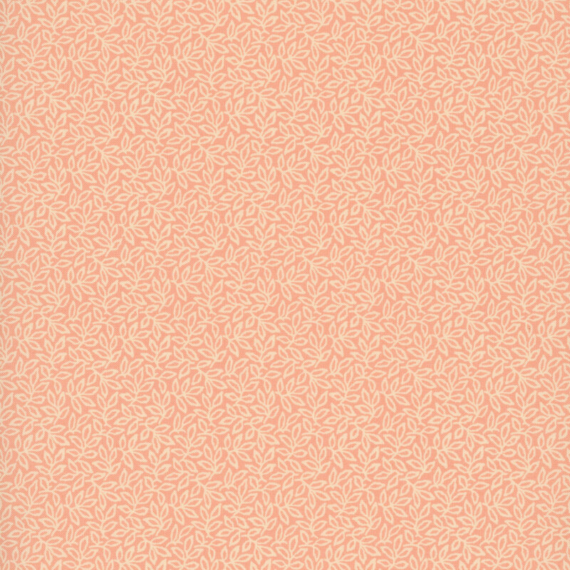 Salmon fabric with an intricate pattern of densely arranged leaves and winding vines.