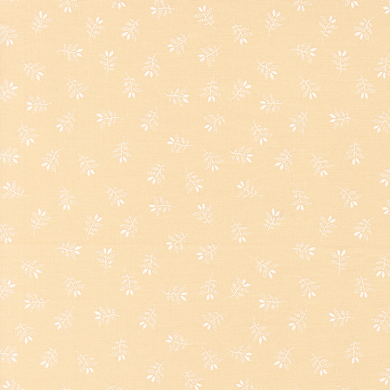 Tan fabric with a charming tossed pattern of gracefully stylized leaves.