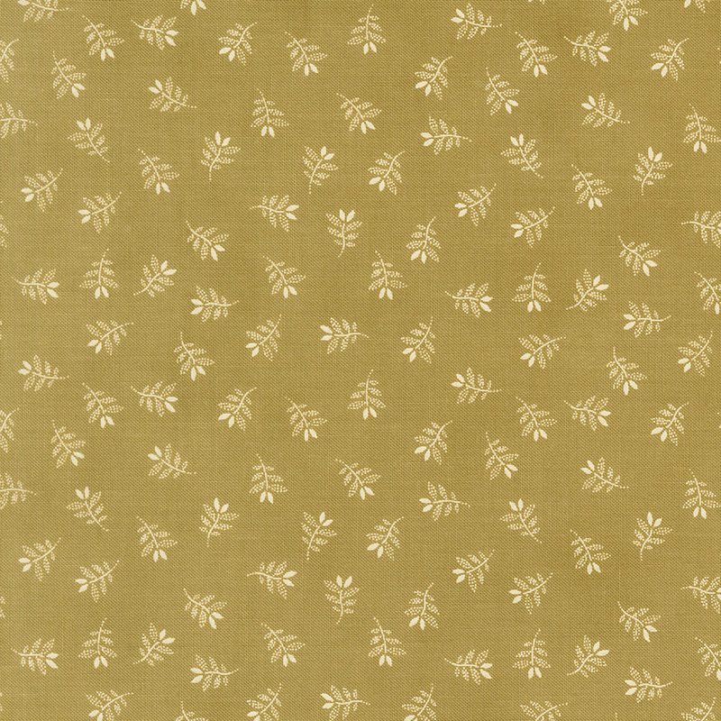 Green fabric with a charming tossed pattern of gracefully stylized leaves.