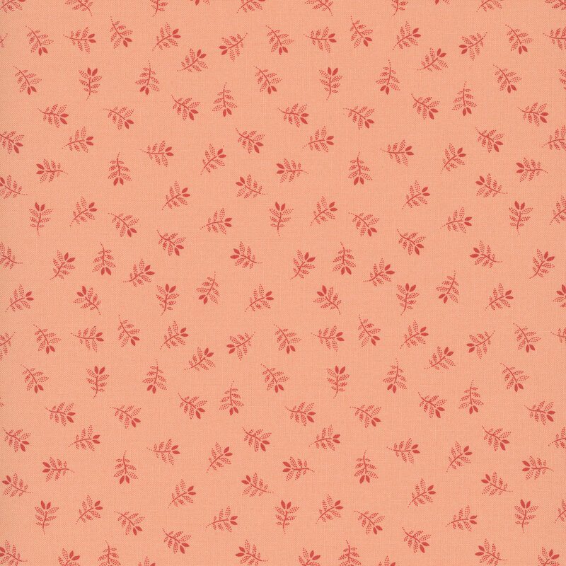 Salmon fabric with a charming tossed pattern of gracefully stylized leaves.