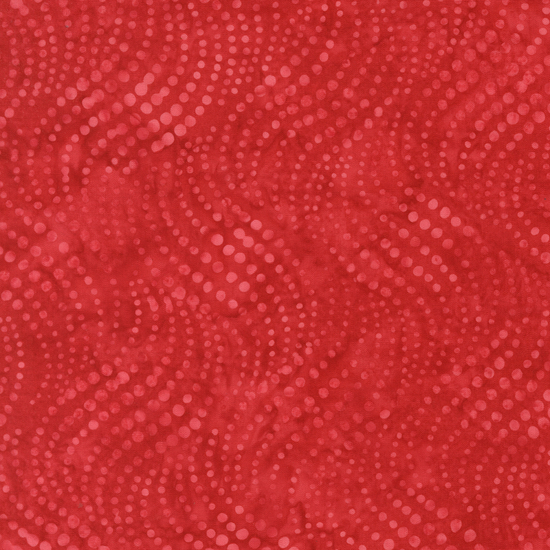 Rose red batik with waving vertical lines of dots in varying sizes.