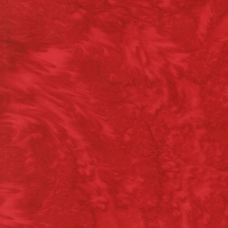 Plain rose red batik with tonal swirling.