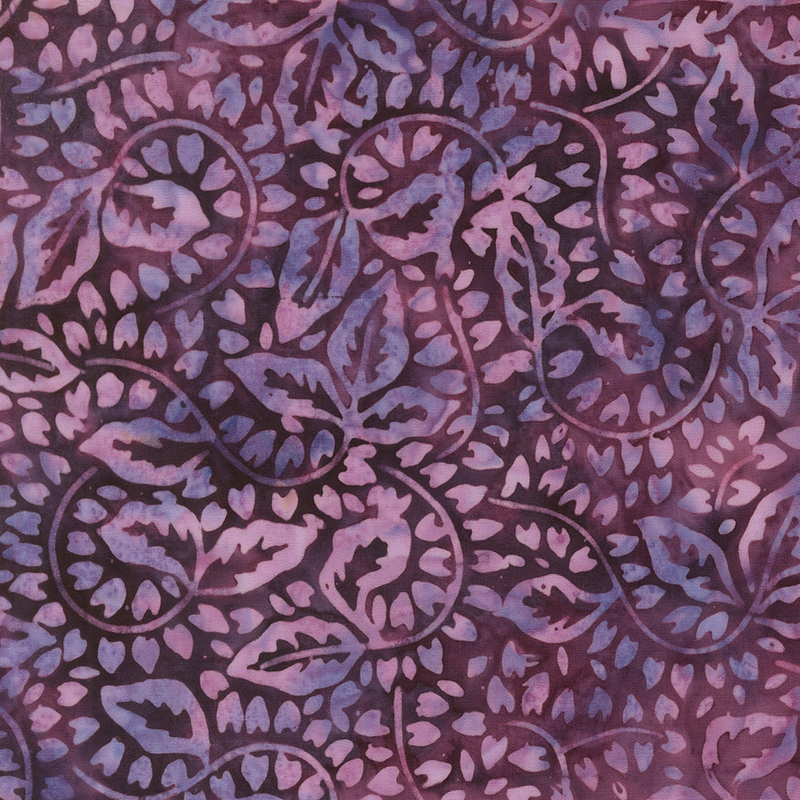 Grape and eggplant colored batik with a heather purple swirling floral and vine design.