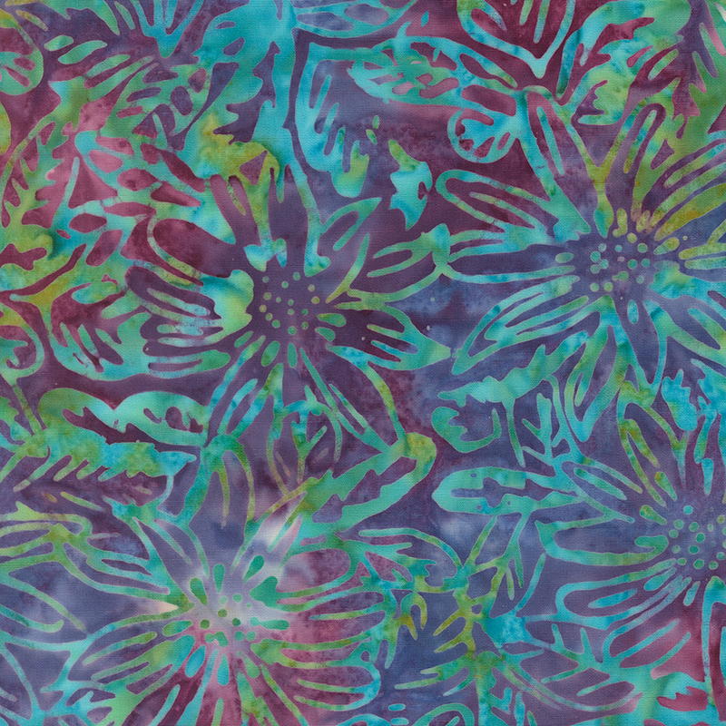 Multicolored batik topped with aqua and green florals and leaves