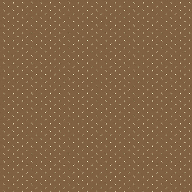 Brown fabric with a charming pattern of small, primitive tan motifs scattered throughout.