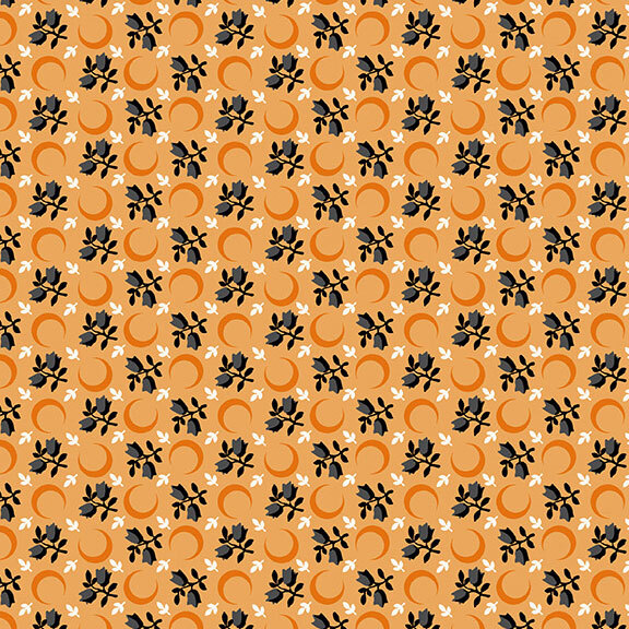 A light orange fabric with scattered crescent moons, floral sprigs, and leaves. 
