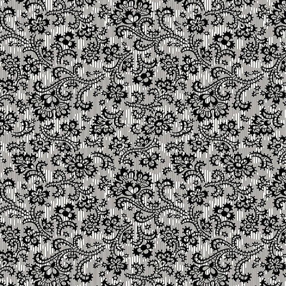 A white fabric with intricate lace florals and vines. 