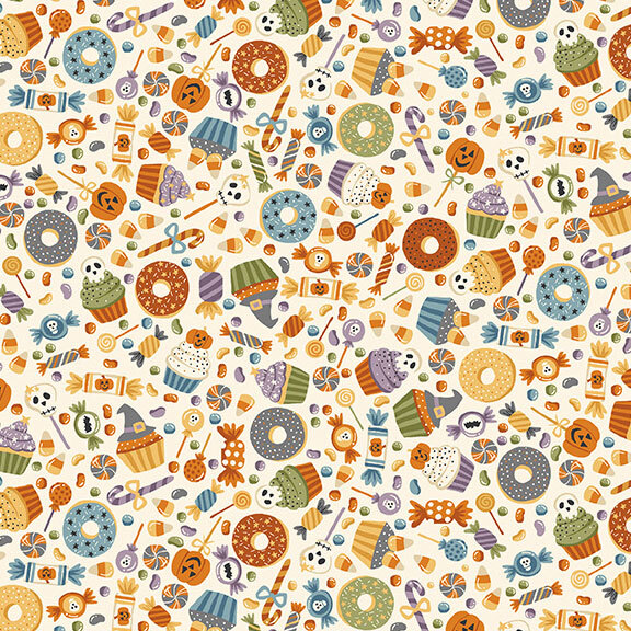 Halloween-themed candies and treats scattered on a soft cream background.