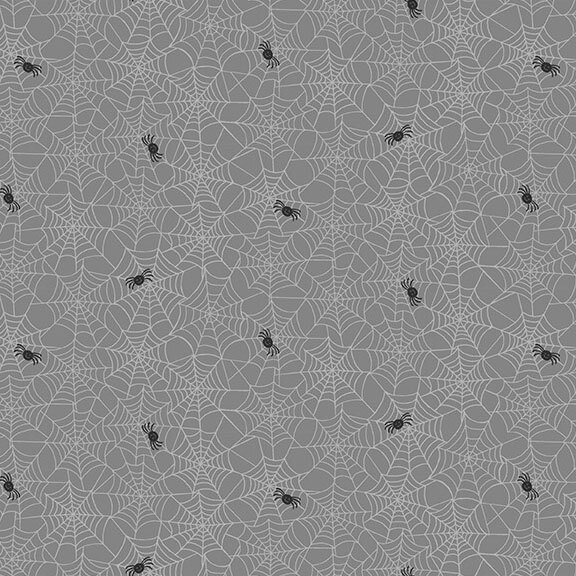 Slate grey fabric featuring interconnected spiderwebs with scattered black spiders.