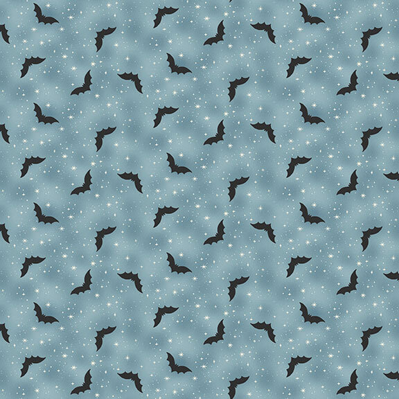 mottled blue gray fabric decorated with white stars and black bats.