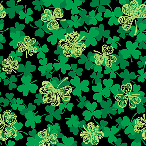 Fabric with Green shamrocks and decorative clovers on a black background.