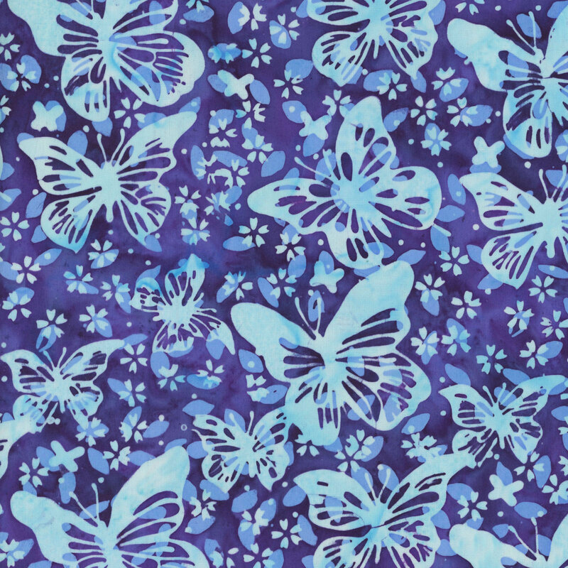 mottled dark violet batik fabric featuring butterflies with stylized floral blossoms and dots in shades of ice blue and periwinkle