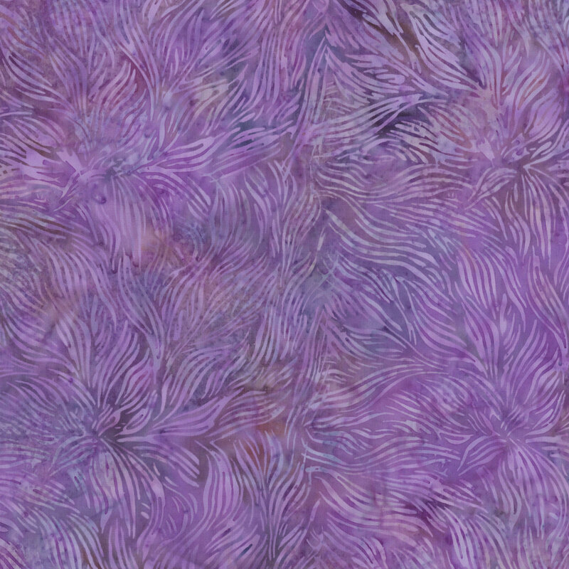 mottled purple batik fabric featuring a swirling leafy frond print