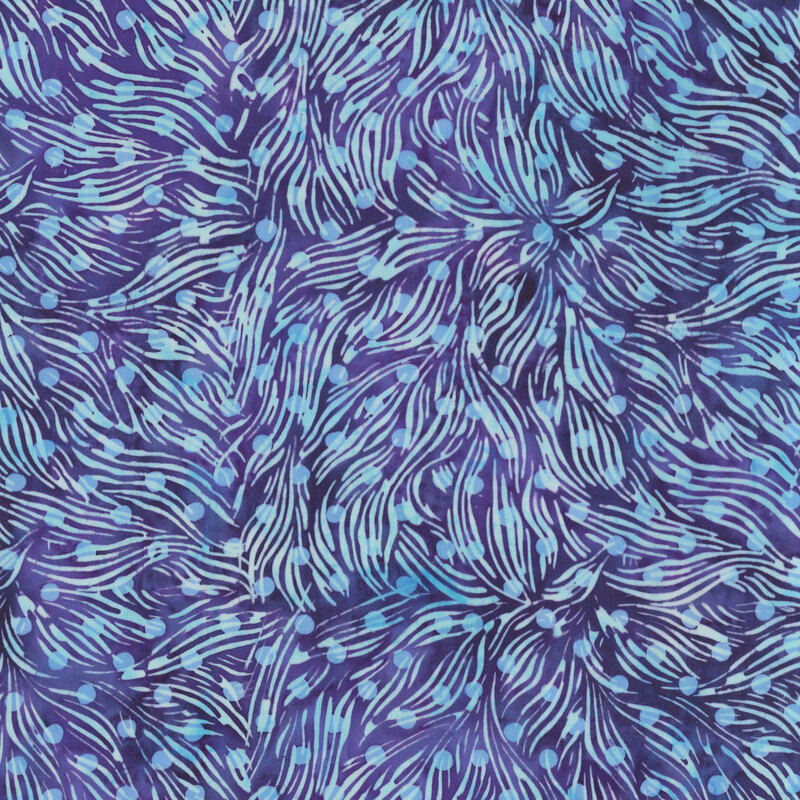 mottled violet batik fabric featuring a swirling leafy frond print with a dotted overlay in hues of bright aqua and ice blue.