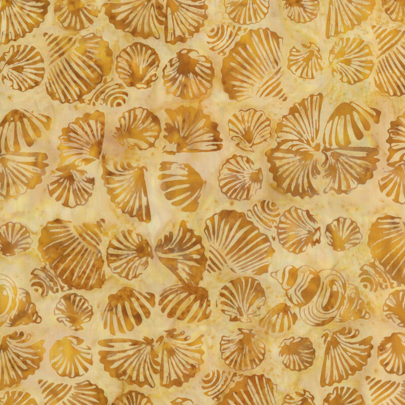 A mottled gold batik with seashells.